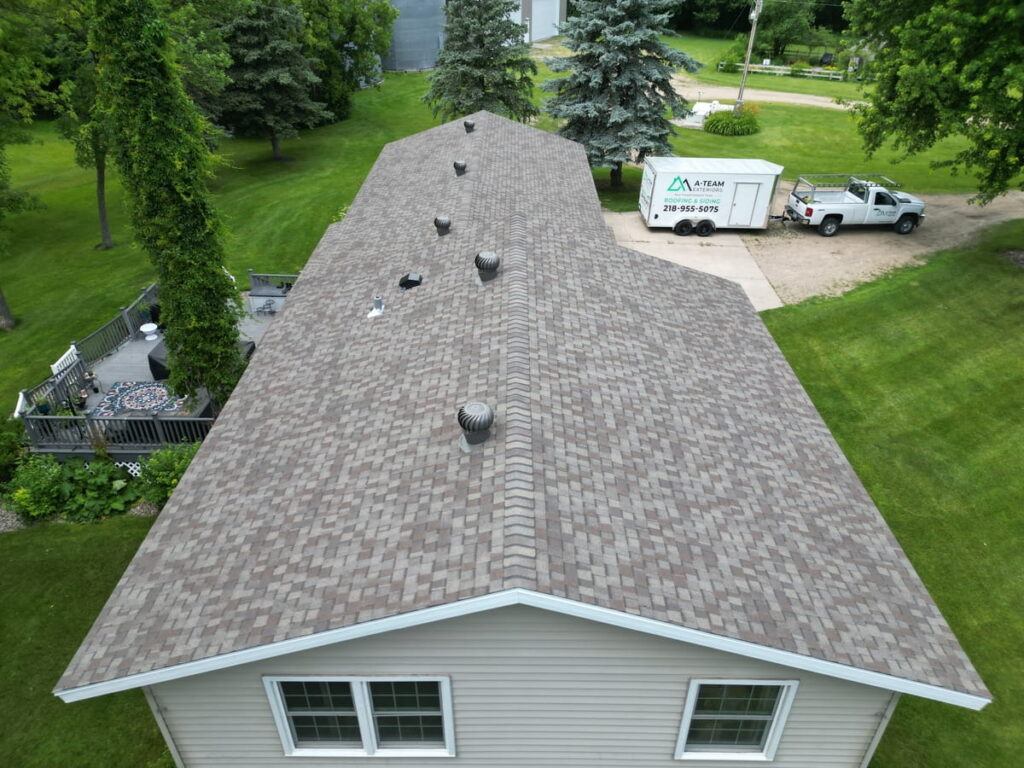 Completed asphalt shingle roof on a house in Wahpeton, ND